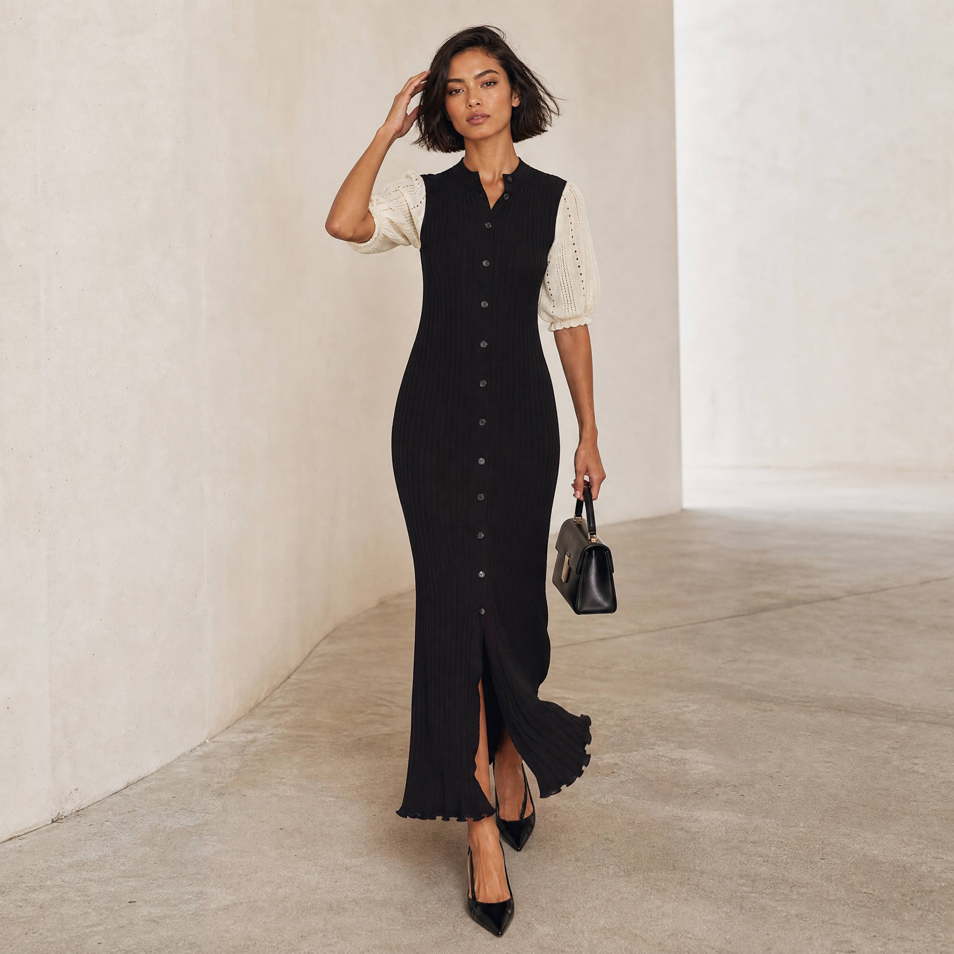 Selene Knit Maxi — movement shot, mid-stride with hand through hair