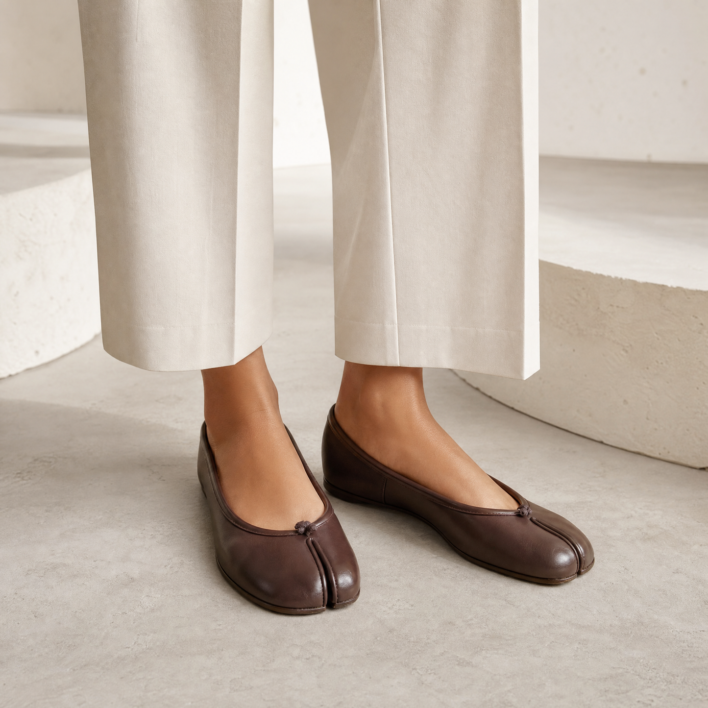 Iris Tabi Flat in Chocolate — on-model with cream wide-leg trousers