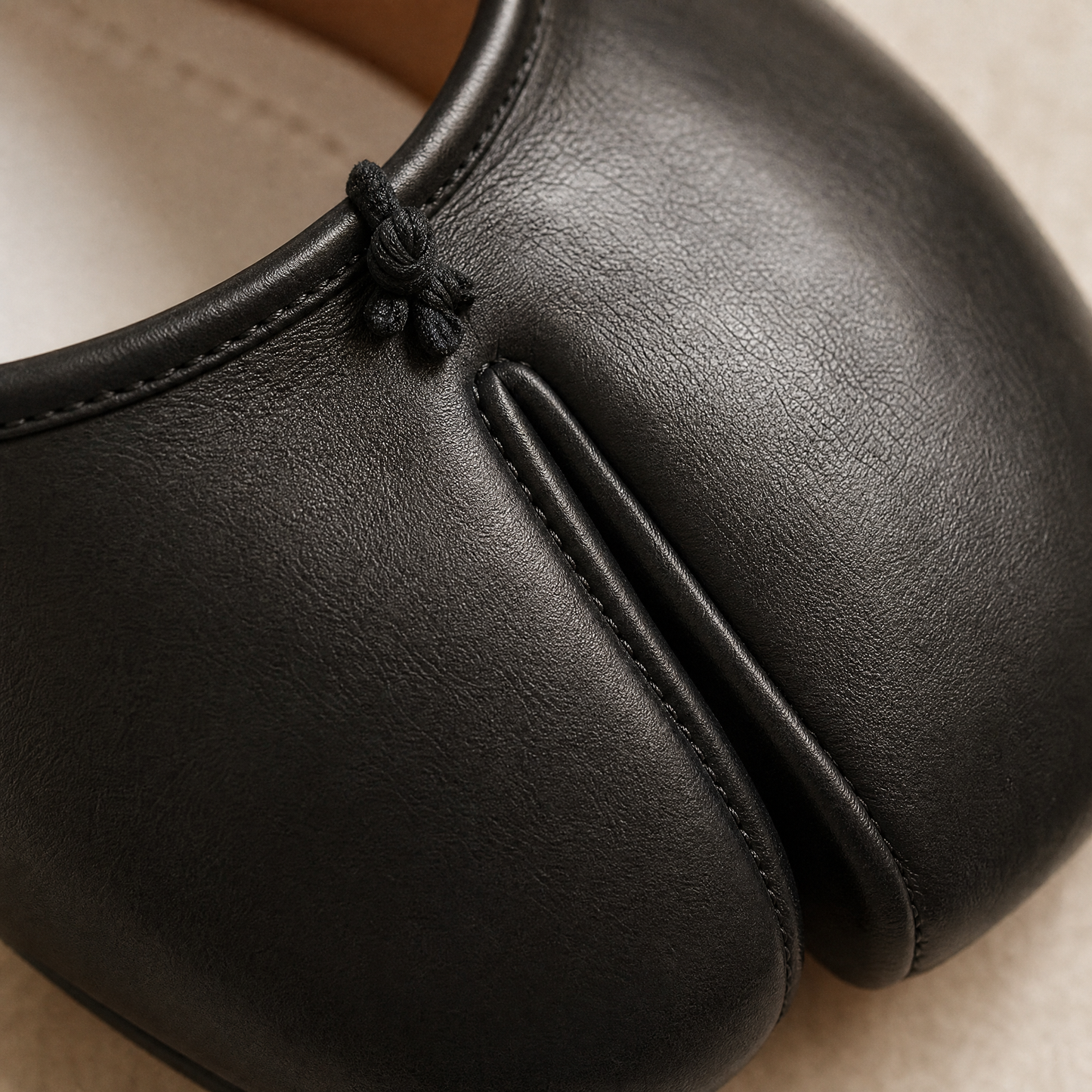 Iris Tabi Flat — macro split-toe construction detail